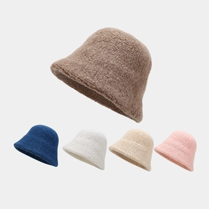 Close-up of wool blend bucket hats in coffee, navy, white, beige and pink soft textures