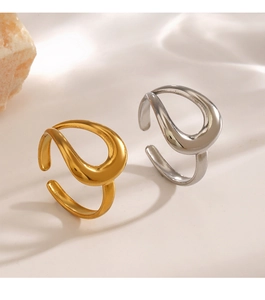Detail shot of minimalist wave rings in polished gold and silver finishes