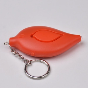 Close-up of orange leaf-shaped personal alarm keychain with integrated LED light