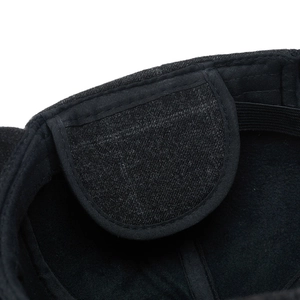 Detailed close-up of winter baseball cap interior featuring fleece flaps and elastic strap