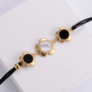 18k gold plated double-layer plum blossom bracelet with black onyx and white mother of pearl
