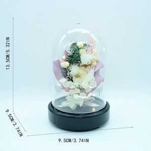 Preserved flowers in glass dome with LED lights, dimensions 13.5cm height and 9.5cm base