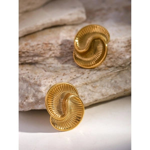 Detail shot of gold-plated stainless steel spiral earrings with unique water drop texture
