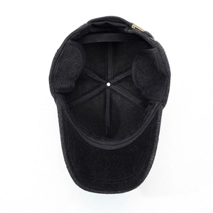 Winter wool baseball cap with ear flaps and warm lining shown from an inner perspective