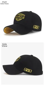 Détail de broderie jaune sur casquette en coton noir avec texte New York 1985