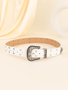 Detailed view of white punk belt featuring vintage silver carved buckle and metal rivets
