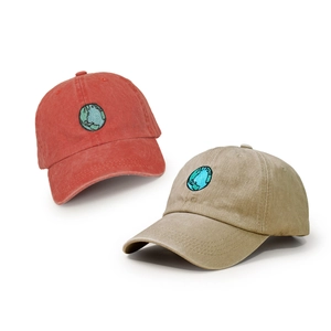 Washed cotton baseball caps in terracotta and khaki with globe embroidery and curved brim