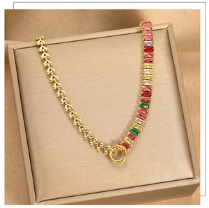 Macro shot of titanium necklace featuring multi-color square zircons and gold bead chain