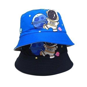 Detail of space-themed embroidery featuring astronauts and stars on cotton sun hats