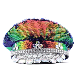 Detailed close-up of colorful iridescent sequins and silver rhinestones on the captain hat