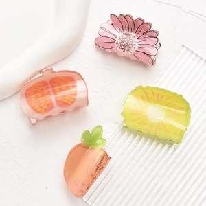 Set of 4 mini acrylic fruit and flower hair clips featuring cute colorful summer designs