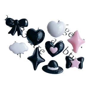 DIY resin accessories set with bow ties, hearts, and stars for nail art and jewelry making