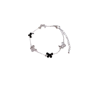 Elegant gold-plated geometric flower bracelet with five clover charms and adjustable clasp