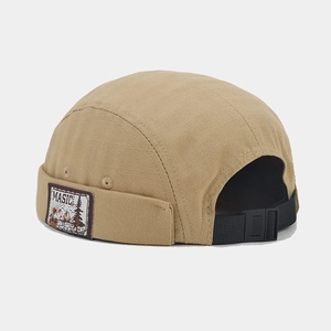 Macro detail of khaki docker hat showing ripstop texture and adjustable back strap