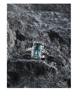 Macro shot of S925 sterling silver ring with wrinkled texture and blue sapphire stone