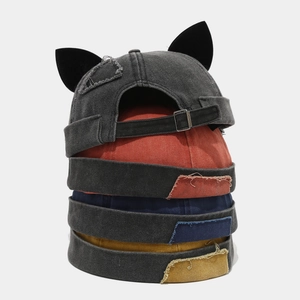 Stacked vintage brimless docker caps with fox ears and distressed washed denim patchwork