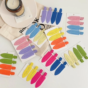 Close-up of matte macaron colored hair clips set on display cards for girls
