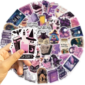 Close-up of waterproof witch craft stickers showing magic potion and cat designs