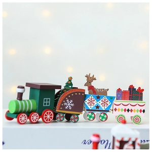 Close-up of a decorative wooden Christmas train with miniature trees and deer figures