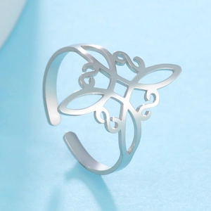 Macro detail of silver stainless steel witch knot adjustable ring with hollow design