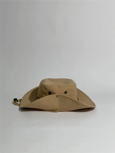 Detail of khaki outdoor boonie hat with wide brim, side snaps and adjustable chin strap