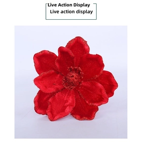 Close-up of red velvet artificial Christmas flower with sparkling glitter edges