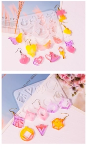 Detailed macro view of silicone molds with heart and cat shaped resin earrings