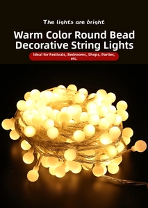 Close-up of warm white frosted LED globe string lights with transparent wires for decoration