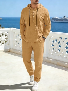 Detailed texture of men's khaki linen hoodie and matching drawstring pants for vacation