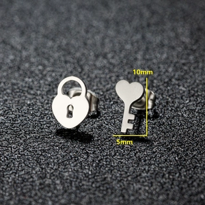 Asymmetric heart lock and key stainless steel stud earrings with 10mm height detail