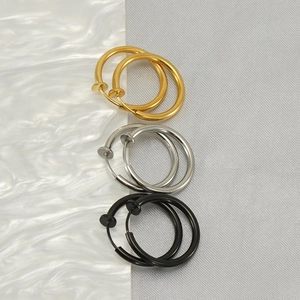 Three pairs of stainless steel non-piercing round clip-on earrings in gold silver and black