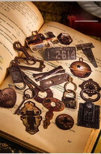 Retro industrial stickers featuring keys and gears on a vintage open book background