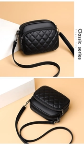 Detail view showing black quilted PU leather crossbody bag with long shoulder strap