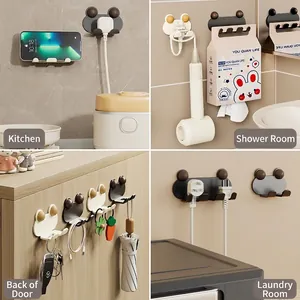 Adhesive wall hooks for power plugs featuring cute bear design in four home scenes