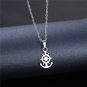 Silver stainless steel nautical necklace with anchor and wheel pendant on display