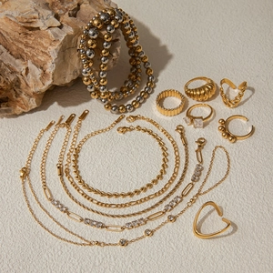 Elegant 18K gold and silver stainless steel jewelry set including necklaces and rings