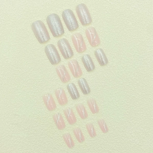 Silver glitter and nude pink press-on nails with white wave lines in square shape