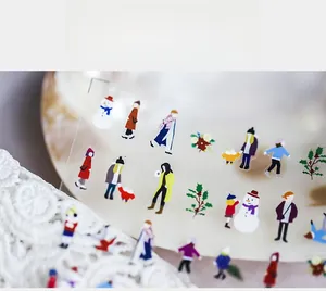 Macro shot of ultra-thin nail art stickers with winter theme illustrations and characters