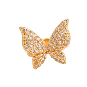 Detailed close-up of golden butterfly ear cuff paved with sparkling white cubic zirconia