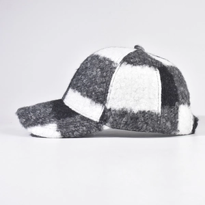 Classic black and white checkered baseball cap in plush sherpa fleece for winter wear