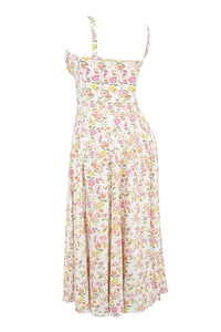 Detailed close-up of white summer slip dress featuring pink and yellow floral patterns