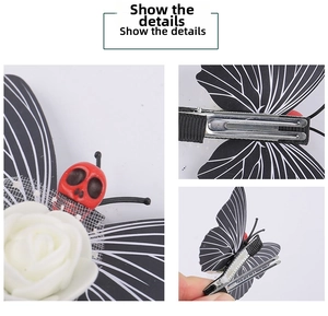 Detail view of gothic butterfly hair clip with white roses and skull eye decoration