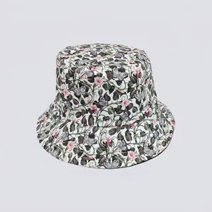 Detail of floral bucket hat with pink flower and purple butterfly print on cotton canvas