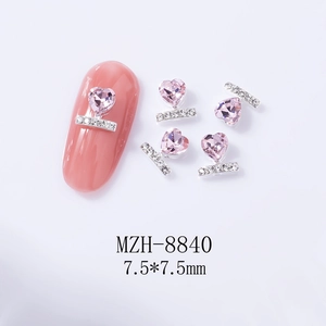 Macro shot of silver heart crystal nail charms with model MZH-8840 dimensions 7.5x7.5mm