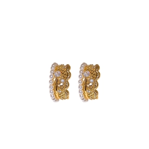 French retro gold earrings with pearls and lace-like zircon detail on white background