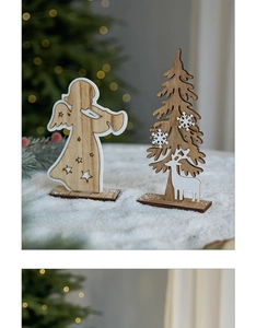 Detail of wooden Christmas ornaments featuring laser-cut angel, tree, and reindeer shapes