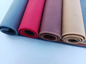 Close-up of dual-layer microfiber towels in four colors with high-density stitched edges