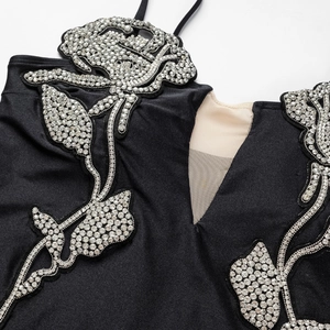 One-piece swimsuit featuring sparkling silver rhinestone roses and sheer mesh neckline