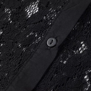 Close-up of black lace fabric and button-down placket on sexy short polo shirt