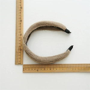 Classic beige knit twist headband for women shown with scale measurements on white base